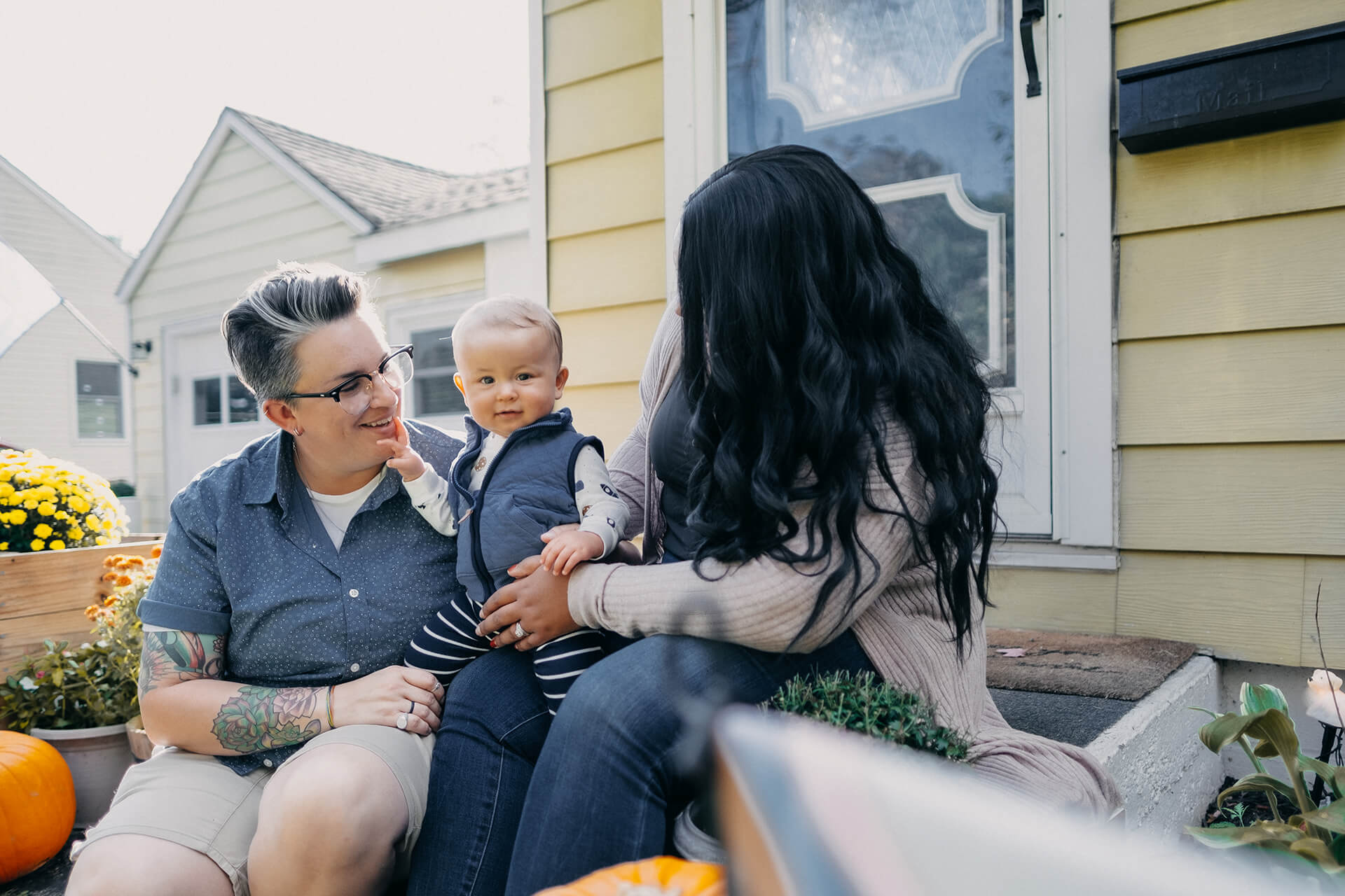 Baby And Moms In Front Of House