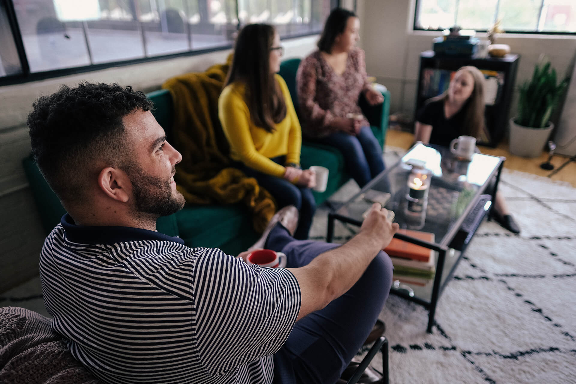 Friends Drinking Coffee In Apartment