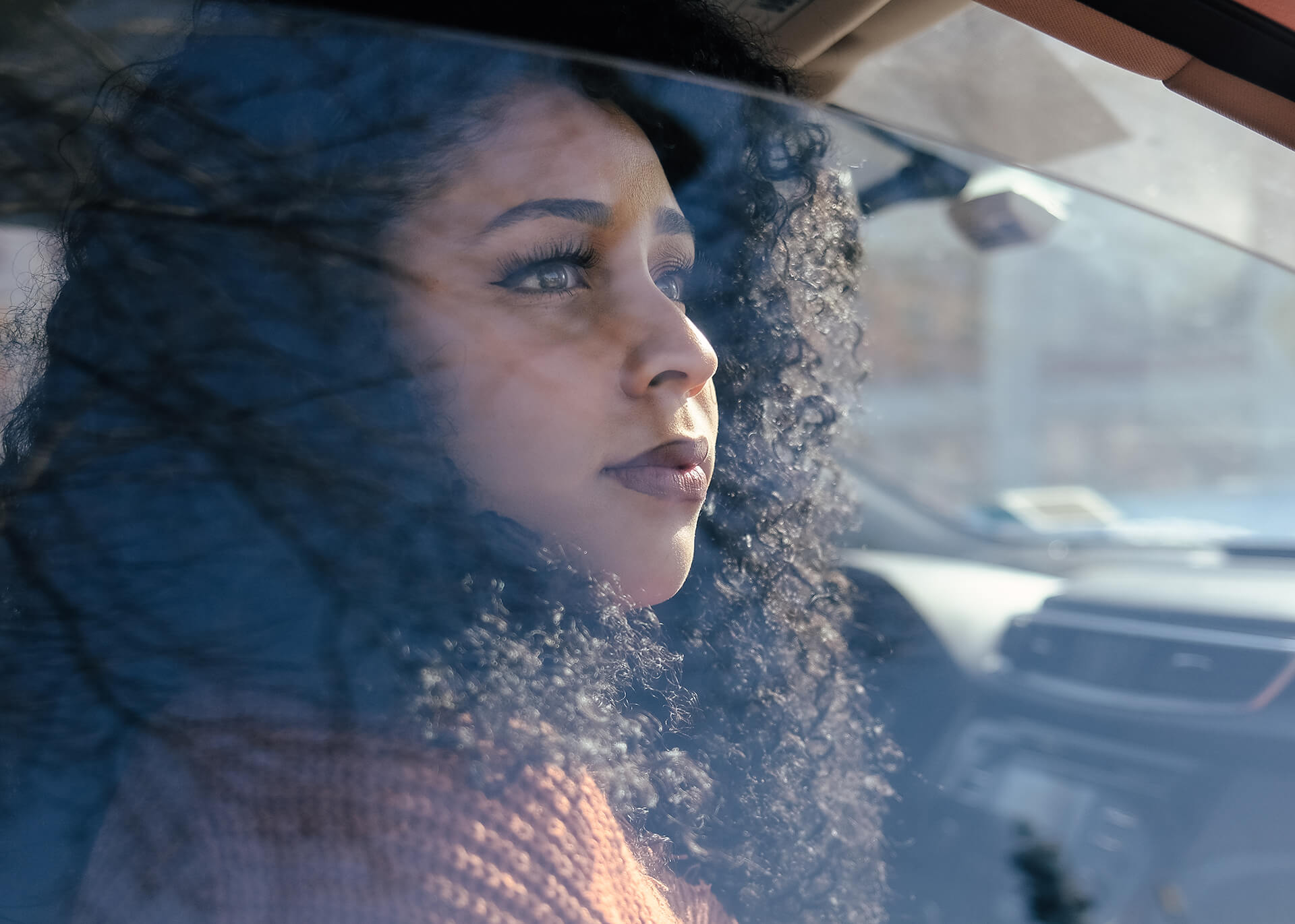 Woman Looking Out Of Car Window