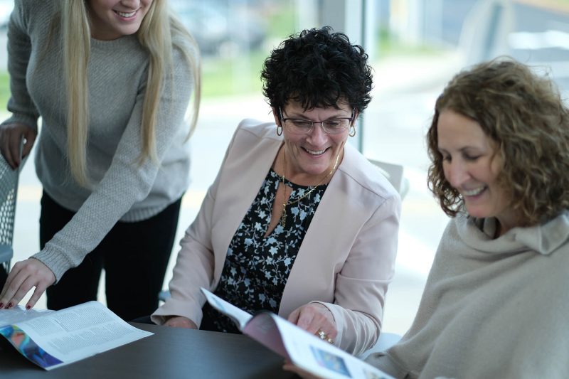 Women Looking At Magazine